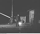 Fotothek df roe-neg 0006213 023 Nachtansicht eines Bahnhofs mit Schrankenwärter.jpg
